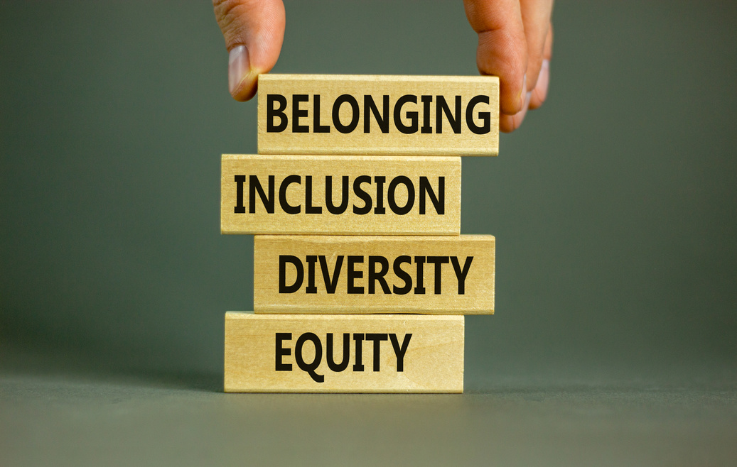 Equity, diversity, inclusion and belonging symbol. Wooden blocks with words 'equity, diversity, inclusion, belonging' on beautiful grey background. Diversity, equity, inclusion and belonging concept.